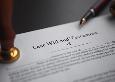 Photo of a last will and testament with a seal and fountain pen